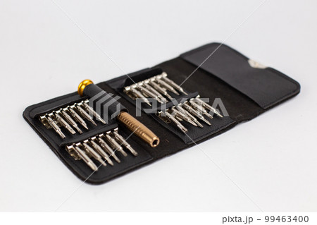 a set of screwdrivers in a leather case on a white background 99463400