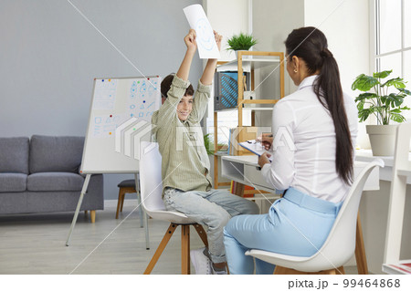 Young boy and elegant psychotherapist together solved problem related to communication with classmates. 99464868