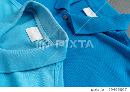 Blue cotton polo t-shirt texture close up Blue cotton polo t-shirt texture close up 99466007