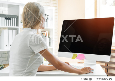 Stay safe and working from home. Young woman working at home. 99466539