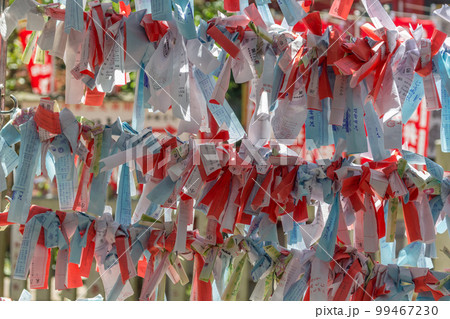 Omikuji paper strips at Enoshima shrine, Enoshima island, Fujisawa, Kanagawa prefecture, Japan. Omikuji paper strips at Enoshima shrine, Enoshima island, Fujisawa, Kanagawa prefecture, Japan. 99467230