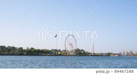 Sharjah cityscape with UAE flag 99467288