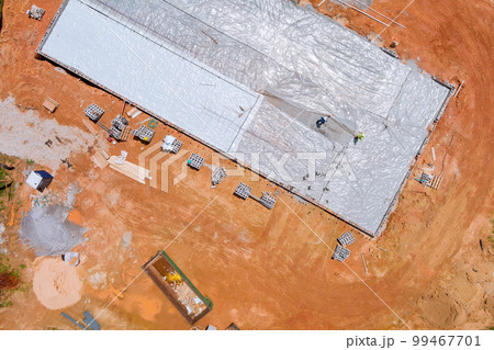 Polyethylene is laid down as waterproofing layer before concrete is poured into foundation 99467701