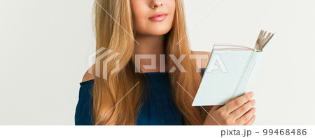 Education, library and literature concept, woman reading a book 99468486