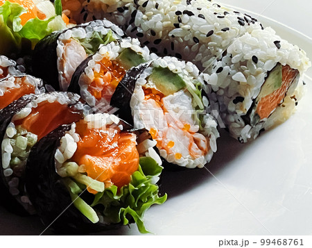 Food and diet, japanese sushi in a restaurant, asian cuisine as meal for lunch or dinner, tasty recipe idea Food and diet, japanese sushi in a restaurant, asian cuisine as meal for lunch or dinner, tasty recipe idea 99468761
