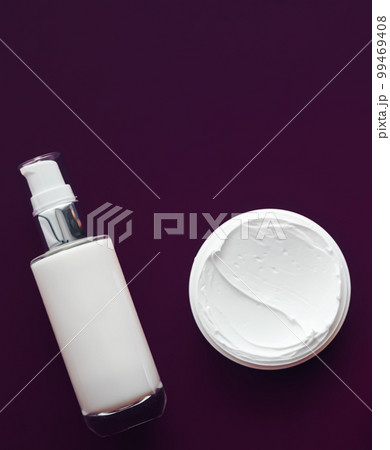 Beauty cosmetics and skincare product on purple background, flatlay. 99469408