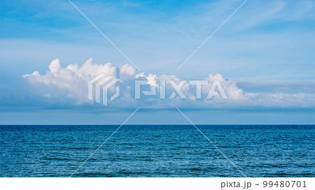 BANNER Atmosphere long panorama real photo beautiful summer white cloud clear blue sky horizon line calm sea. Concept paradise life. Design relax wallpaper background. More tone format in stock BANNER Atmosphere long panorama real photo beautiful summer white cloud clear blue sky horizon line calm sea. Concept paradise life. Design relax wallpaper background. More tone format in stock 99480701