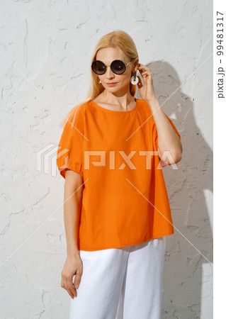 Catchy woman in bright summer outfit Catchy woman in bright summer outfit 99481317