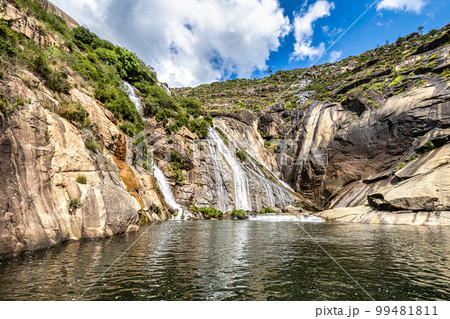 Ezaro waterfall, Galicia, Northern Spain in Spring. It empties into the Atlantic ocean in a waterfall Ezaro waterfall, Galicia, Northern Spain in Spring. It empties into the Atlantic ocean in a waterfall 99481811