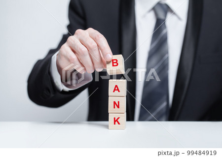 Business concept. Hand with bank inscription 99484919