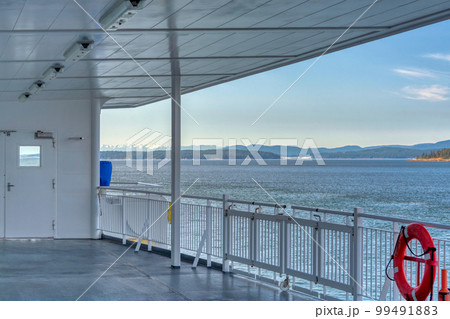 Vancouver island shore view from the deck of a ship Vancouver island shore view from the deck of a ship 99491883