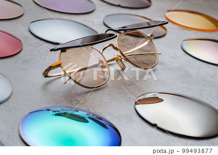 Close up of fashion glasses with changeable colored lenses 99493877