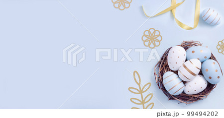 Easter egg and cake on grey table background. Easter egg and cake on grey table background. 99494202