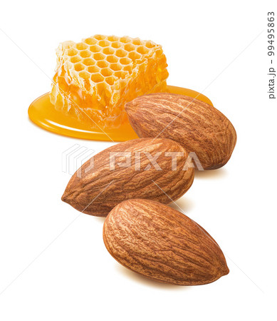 Almonds and honeycomb piece isolated on white background. Nuts and honey. Vertical layout Almonds and honeycomb piece isolated on white background. Nuts and honey. Vertical layout 99495863