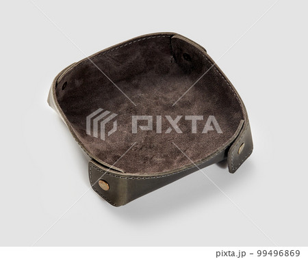 Functional brown leather valet tray for storage of sundries Functional brown leather valet tray for storage of sundries 99496869