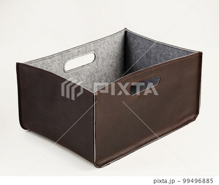 Artisanal brown leather storage bin lined with gray felt Artisanal brown leather storage bin lined with gray felt 99496885