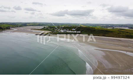 Inchydoney Beach in the Ireland on a cloudy summer day, top view. Seaside landscape. The famous Irish sandy beach. The coastline of the Atlantic Ocean. 99497324