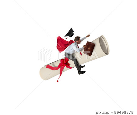 Young graduate boy rides a graduation parchment 99498579