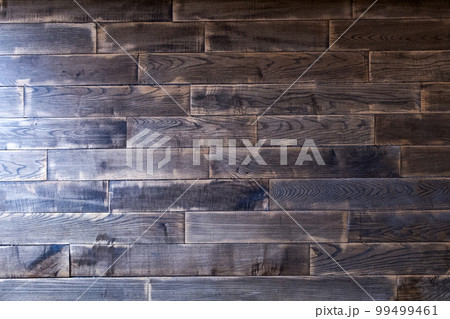 Dark Old parquet wooden texture. with sun light. Natural wood shabby background close-up. 99499461