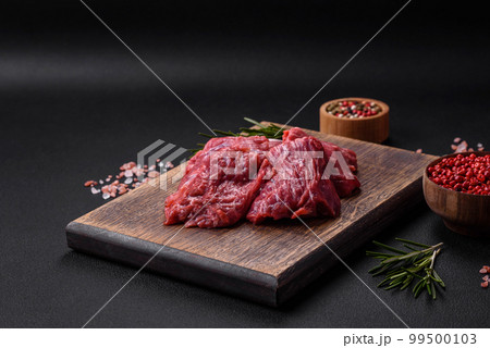 Chopped raw Beef meat on the wooden cutting board, 🇩🇪Prof…