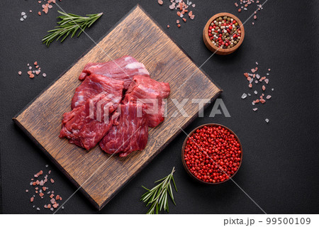 Chopped raw Beef meat on the wooden cutting board, 🇩🇪Prof…