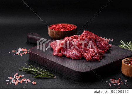 Chopped raw Beef meat on the wooden cutting board, 🇩🇪Prof…