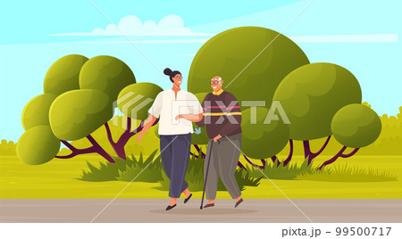 Young woman walks with grandpa in city park summer time, Social worker helping senior elder man Young woman walks with grandpa in city park summer time, Social worker helping senior elder man 99500717