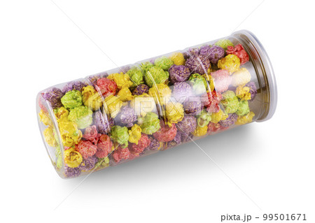 Colorful caramel popcorn in clear jar isolated on white background. 99501671