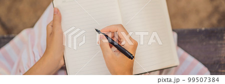 Women's hands in a tropical background holding a signboard, drawing block, paper, mockup BANNER, LONG FORMAT Women's hands in a tropical background holding a signboard, drawing block, paper, mockup BANNER, LONG FORMAT 99507384