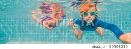 Kids having fun playing underwater in swimming pool on summer vacation BANNER, LONG FORMAT Kids having fun playing underwater in swimming pool on summer vacation BANNER, LONG FORMAT 99508059