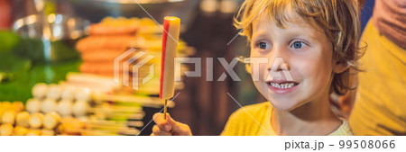 Young boy tourist on Walking street Asian food market BANNER, LONG FORMAT Young boy tourist on Walking street Asian food market BANNER, LONG FORMAT 99508066