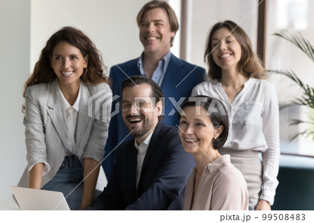 Happy diverse multiethnic business team posing for shooting together Happy diverse multiethnic business team posing for shooting together 99508483
