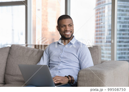 Happy attractive young businessman working on online freelance project Happy attractive young businessman working on online freelance project 99508750