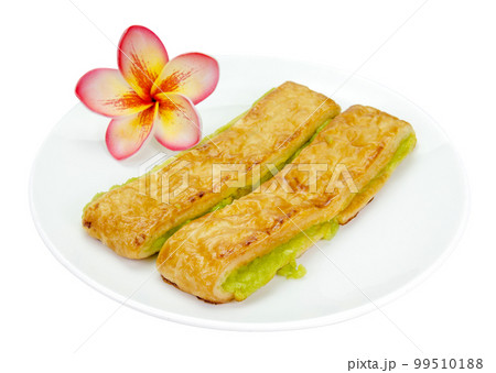 custard bread in a white plate isolated 99510188