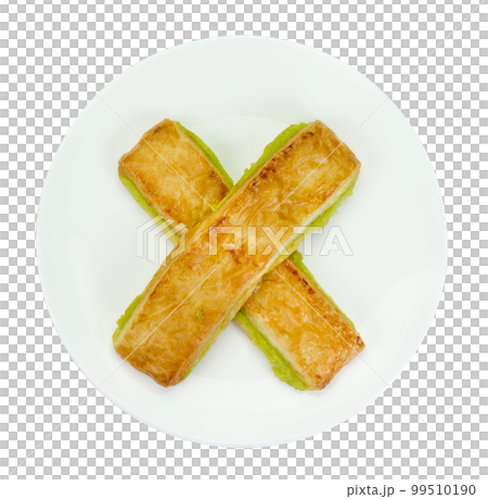 custard bread in a white plate isolated 99510190