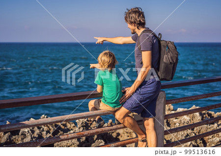 Father and son travelers on amazing Nusadua, Waterbloom Fountain, Bali Island Indonesia. Traveling with kids concept 99513616