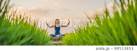 Young woman practice yoga outdoor in rice fields in the morning during wellness retreat in Bali BANNER, LONG FORMAT Young woman practice yoga outdoor in rice fields in the morning during wellness retreat in Bali BANNER, LONG FORMAT 99513653