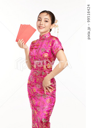 Asian woman wearing traditional cheongsam qipao dress holding angpao or red packet monetary gift isolated on White Background, Chinese new year 99516424