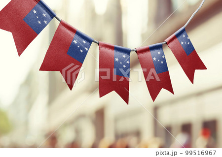 A garland of Samoa national flags on an abstract blurred background A garland of Samoa national flags on an abstract blurred background 99516967