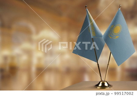 A small Kazakhstan flag on an abstract blurry background A small Kazakhstan flag on an abstract blurry background 99517002