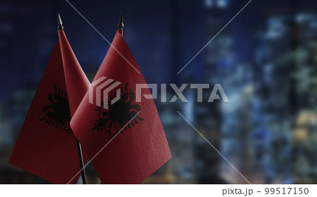 A small Albania flag on an abstract blurry background 99517150