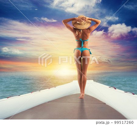 Girl relaxes on a inflatable boat at the sea Girl relaxes on a inflatable boat at the sea 99517260