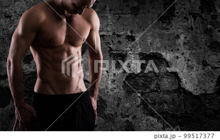 Muscular of a body building trainer man Muscular of a body building trainer man 99517377