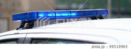 Closeup of blue lights on roof of police car Closeup of blue lights on roof of police car 99519965