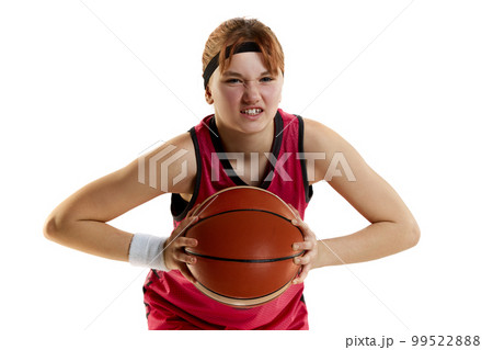 Sportive ambitions and motivation. Teen girl, basketball player posing with ball isolated over white studio background. Concept of professional sport and hobby 99522888