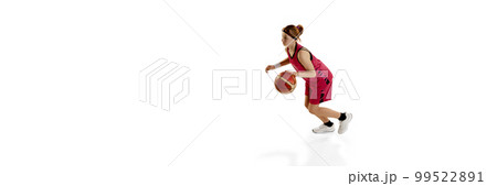 Dribbling. Teen girl, basketball player in motion, playing, training isolated over white studio background. Concept of professional sport and hobby Dribbling. Teen girl, basketball player in motion, playing, training isolated over white studio background. Concept of professional sport and hobby 99522891