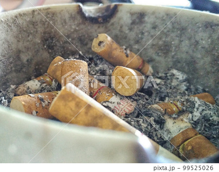 Dust of cigarettes on ashtray. Dust of cigarettes on ashtray. 99525026