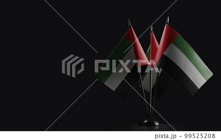 Small national flags of the Arab Emirates on a black background Small national flags of the Arab Emirates on a black background 99525208