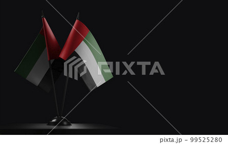 Small national flags of the Arab Emirates on a black background Small national flags of the Arab Emirates on a black background 99525280