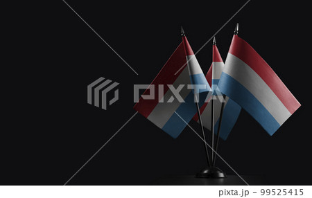 Small national flags of the Luxembourg on a black background Small national flags of the Luxembourg on a black background 99525415
